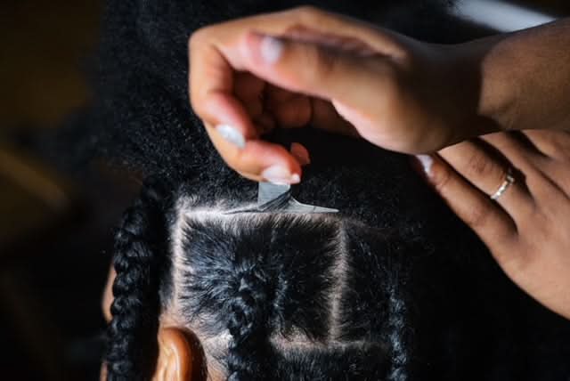 The Braid Aid- Adjustable Finger Parting Tool used to create clean, square parts in natural hair for box braids or stitch braids.