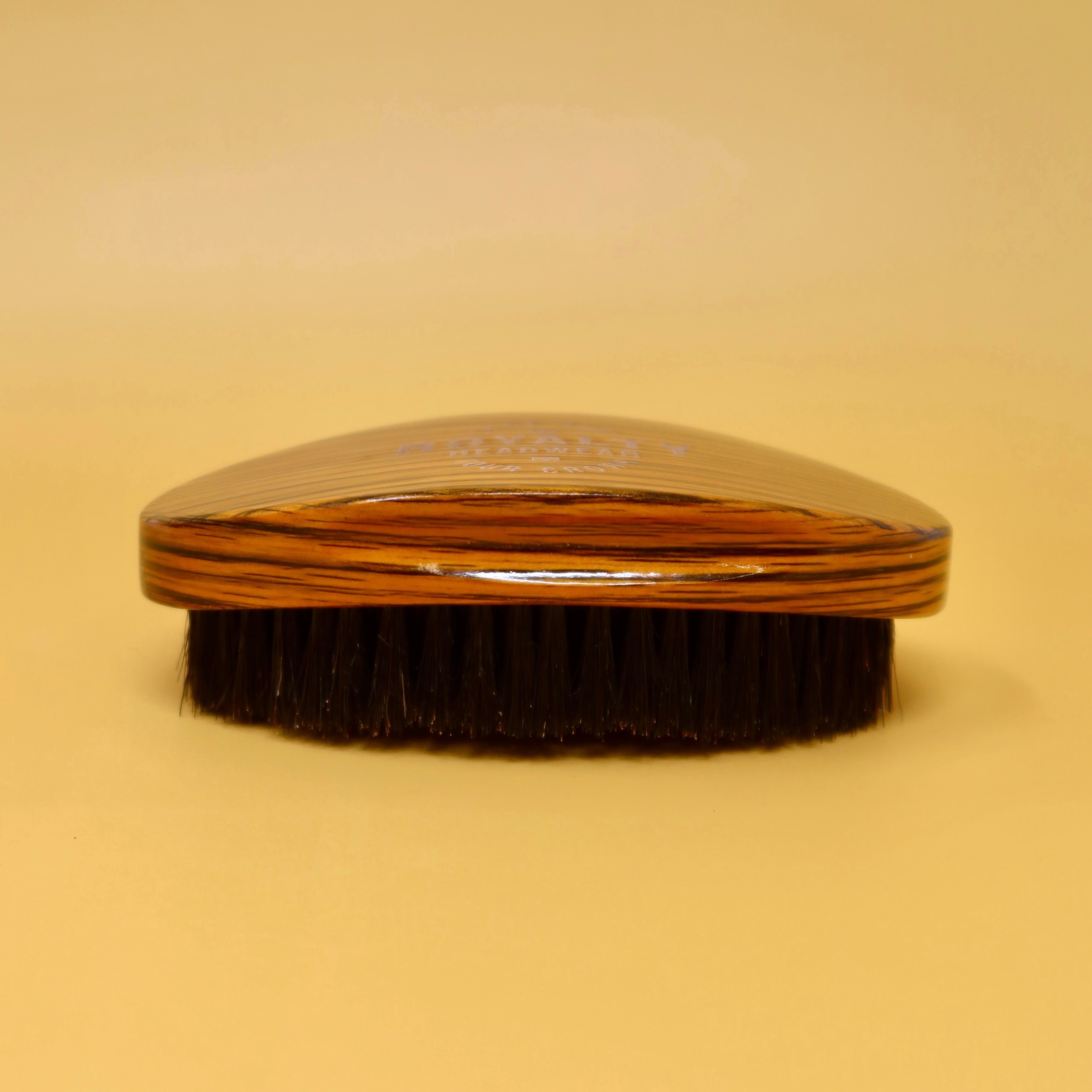 Curved wooden palm wave brush for 360 wave training and definition